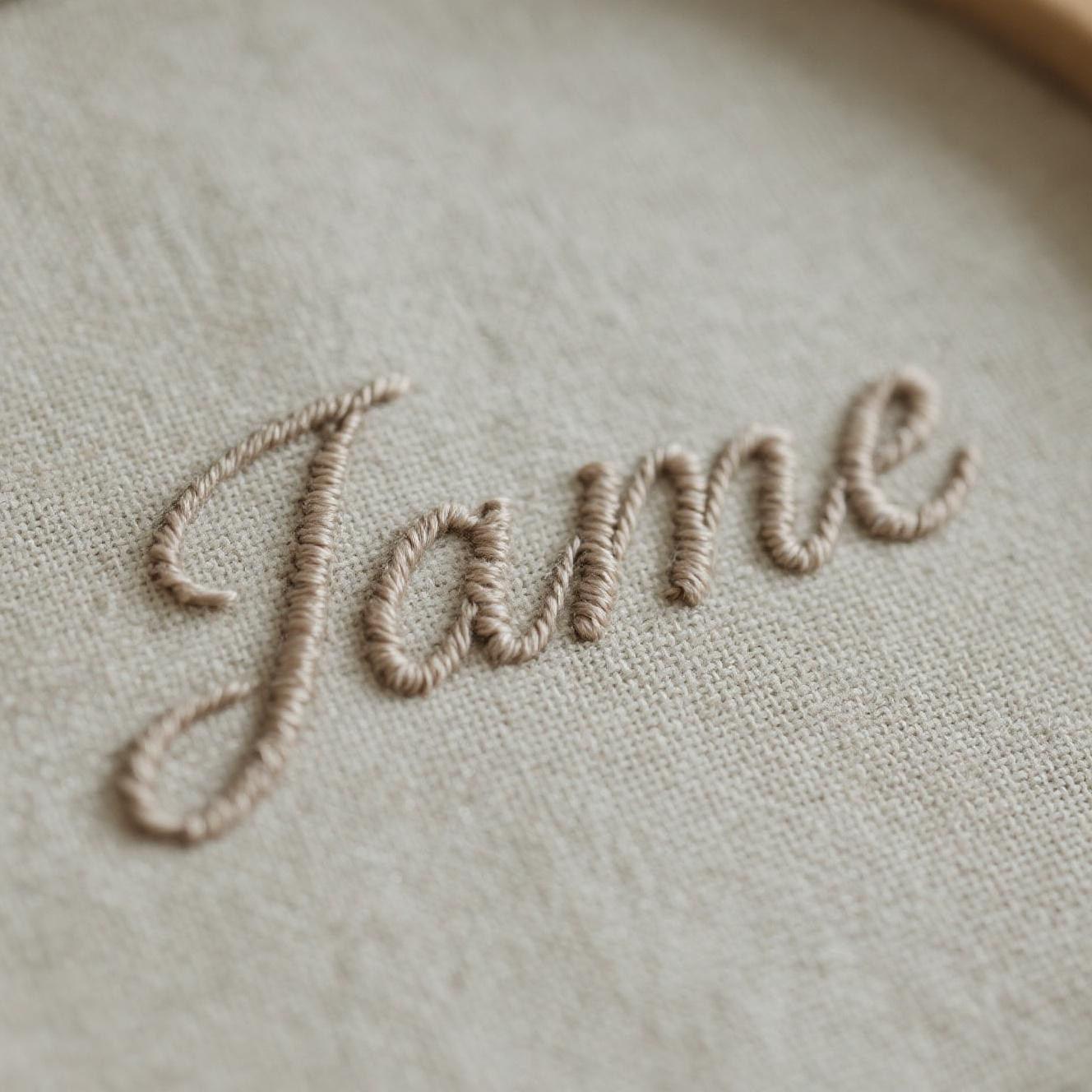 Textile embroidery with raised design